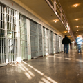 people walking along prison cells New NIH-Department of Justice Study